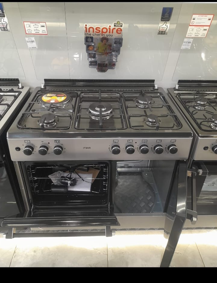 MIKA Standing Cooker, 90cm x 60cm, 4 Gas Pool Jet Burners (1 Wok) + 1 RAPID Hot Plate, Auto Ignition, 4 Function Electric Oven, GAS CYLINDER CABINET, Rotisserie, Mirror Black Hob, Silver Body